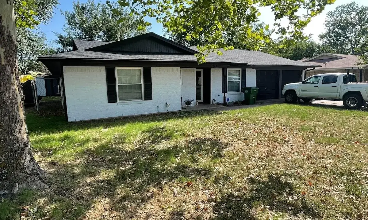 Professional roofing crew working on a residential roof in Chena Ridge